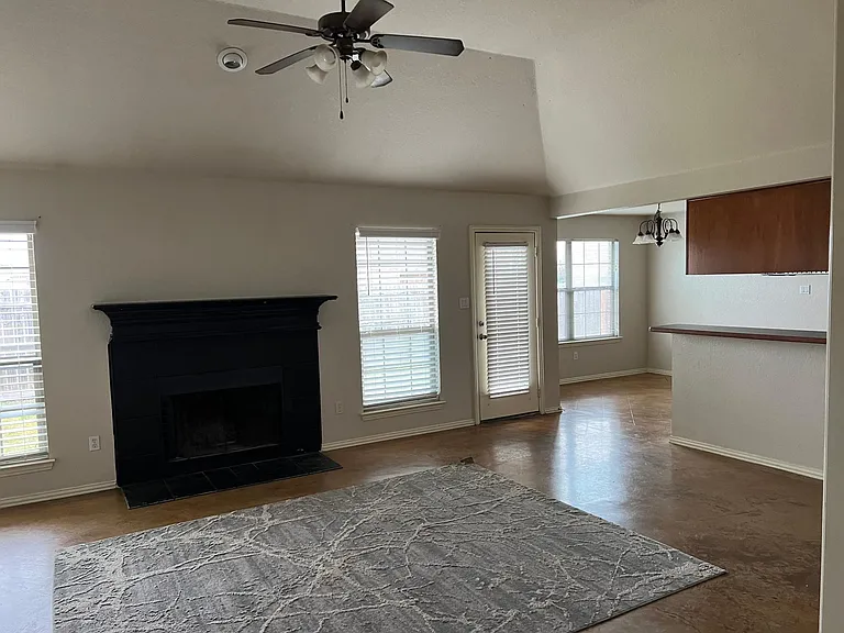 Open concept Living connects to Kitchen and dining. Lots of windows!