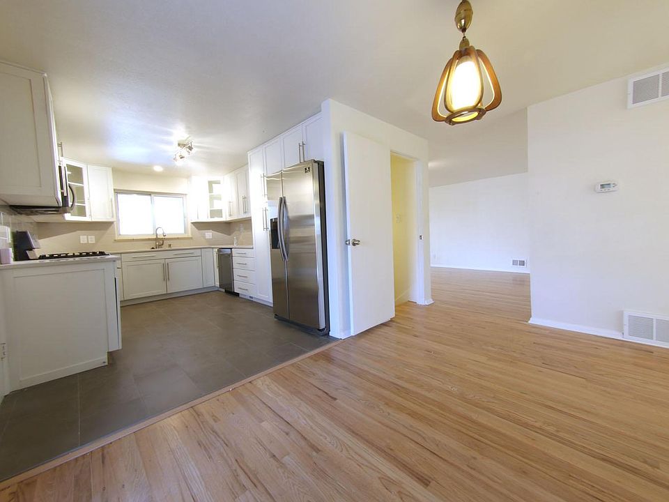 View from dining area of kitchen and into living room.
