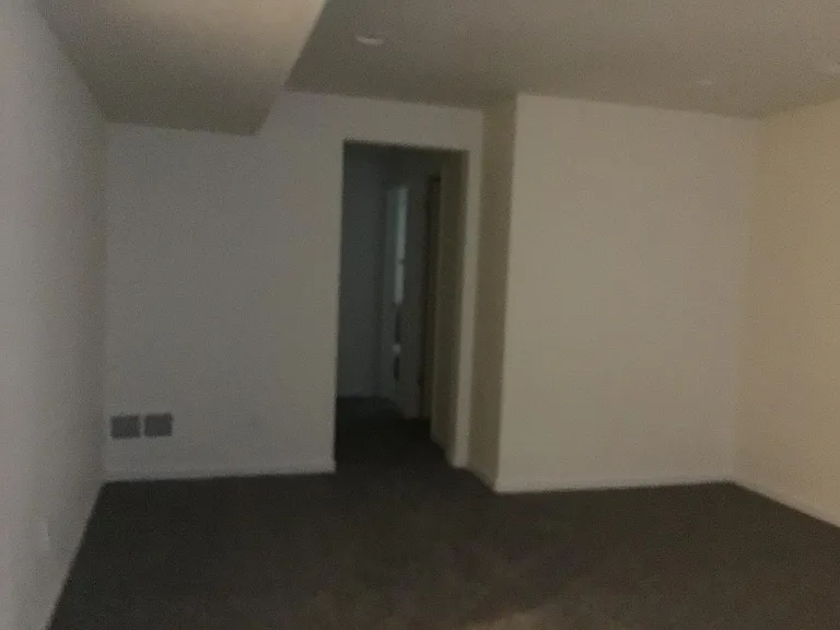 flex space look toward bathroom, walk in closet and utility room areas
