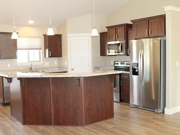 Open Concept Kitchen/Living Room. Kitchen With Island. Island Adds Storage Plus Has Outlets. Pantry With Light. Under Cabinet Lights. New Stainless Steel Appliances. Upgraded Cabinets. Great Kitchen.