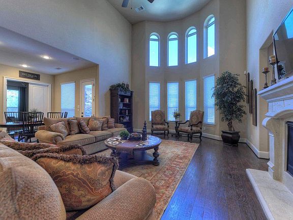 Breathtaking 2-story Family Room with curved wall of windows overlooking the phenomenal backyard paradise!!