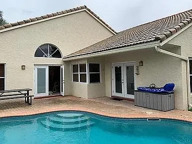 relaxing private SW facing pool and backyard.
