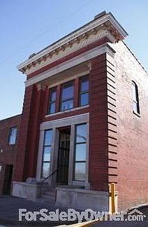 Exterior
						:
						Brick building, thermal pane windows, parking in rear.