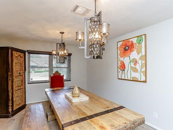 The dinning room is just waiting for your family and friends with hard wood flooring and upgraded white oak flooring this is sim