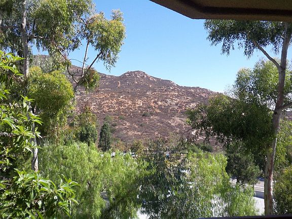 Panoramic mountain views in highly desirable gated complex of Lomas Del Cerro