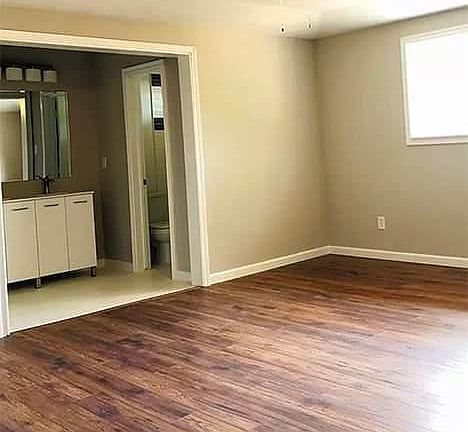 Private bathroom in Master bedroom, two large closets, tray ceiling with fan.