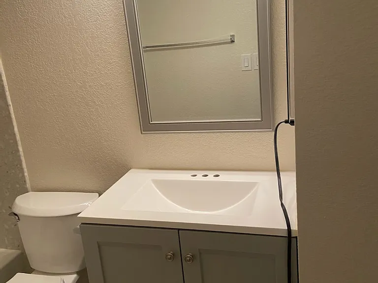 Vanity, mirror and light fixture
