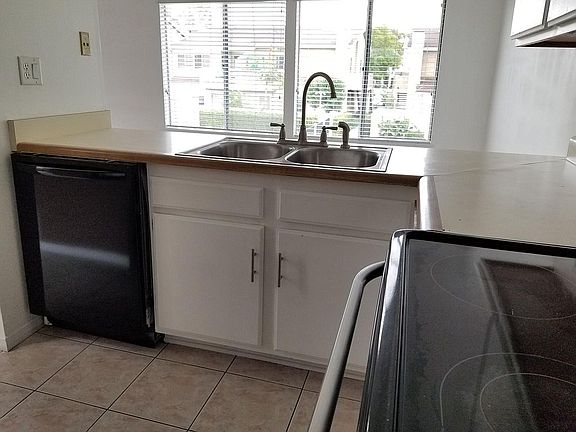 Kitchen with new dishwasher, sink, faucet, and garbage disposal