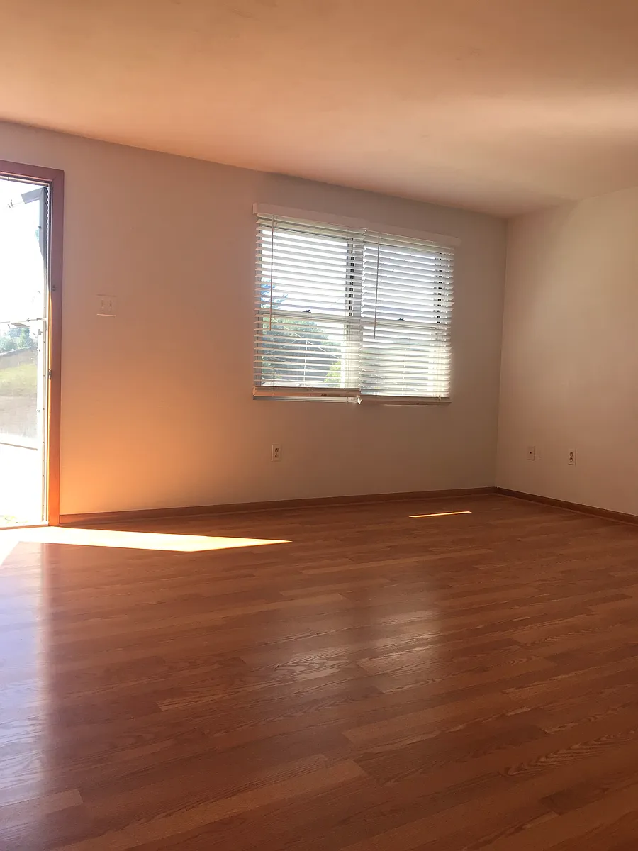 Living room looking to front of building - 8 North St #B