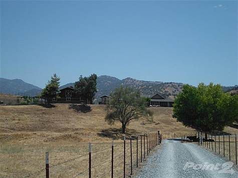 Most of the acreage is flat and perfect for horses or cattle.  The home, RV barn, green house, gardens, etc. are on approx a 1 acre hilltop.