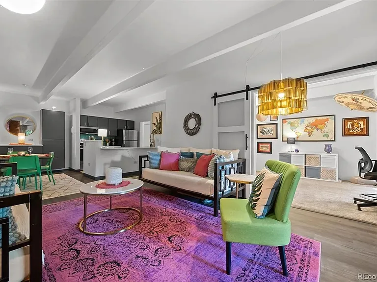 The second bedroom / office is off the living room and separated by sliding barn doors