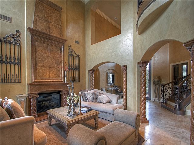 The formal living room is a warm, inviting setting to relax with family