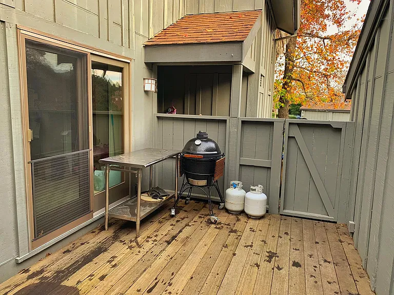 second deck, between kitchen and garage on right.