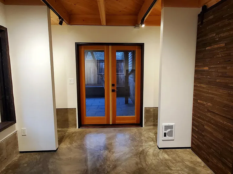 Bedroom view towards private shade patio. Auxiliary wall heater.