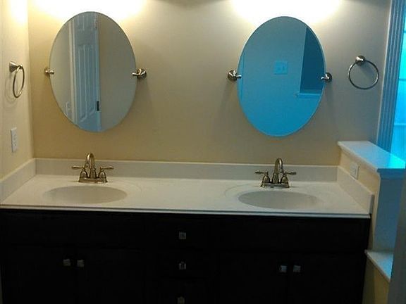 Master bath -- dual vanities with Moen Caldwell brushed nickel faucets and swivel mirrors and lots of storage space!