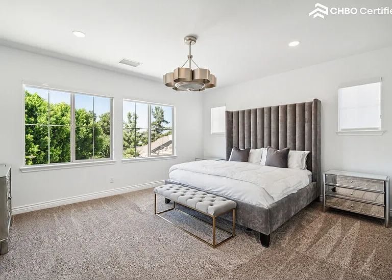 Master Bedroom w/King Adjustable Base Bed plus 65" Smart TV