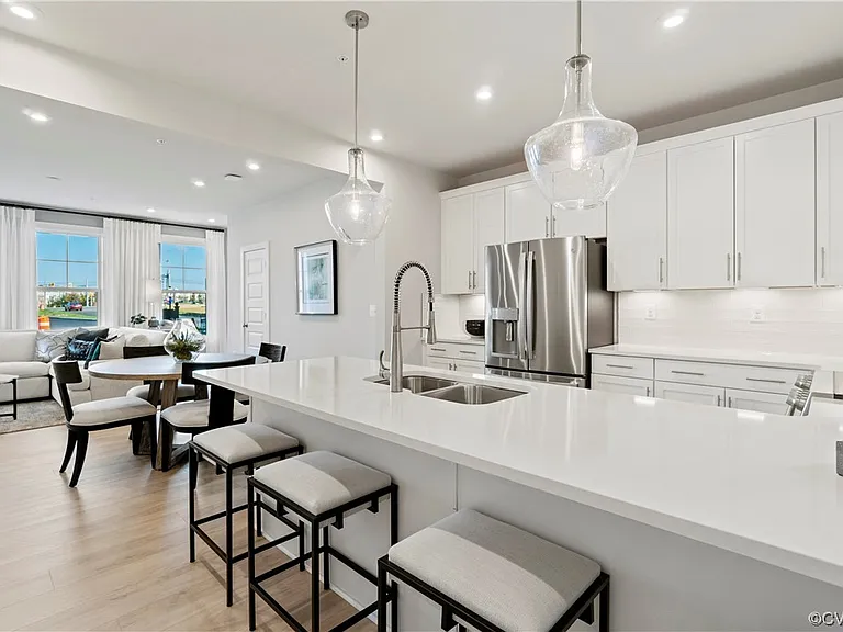 Some photos include stock images of an identical model home. Actual unit finishes, views, and colors may differ.