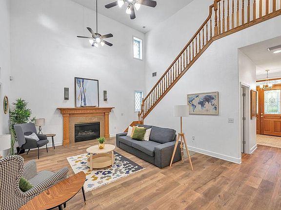 DECORATIVE, GAS FIREPLACE, HALF BATHROOM ON HALLWAY, DUAL CEILING FANS