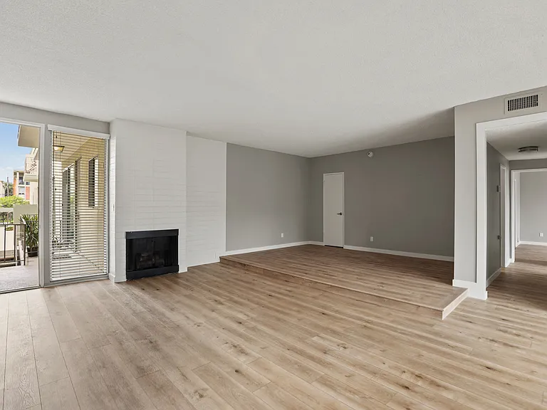 Large-Size Living Room with Electric Fireplace, Vinyl Flooring, and Patio