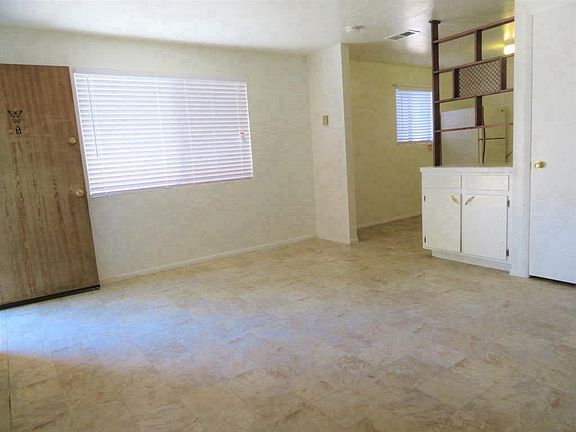 A spacious livingroom with two closets.