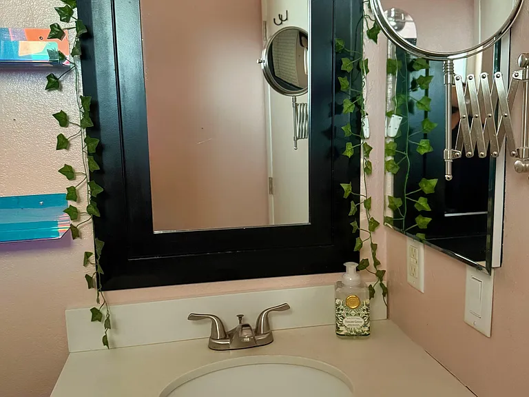 Full bathroom mirror and separate shaving (or makeup) mirror.