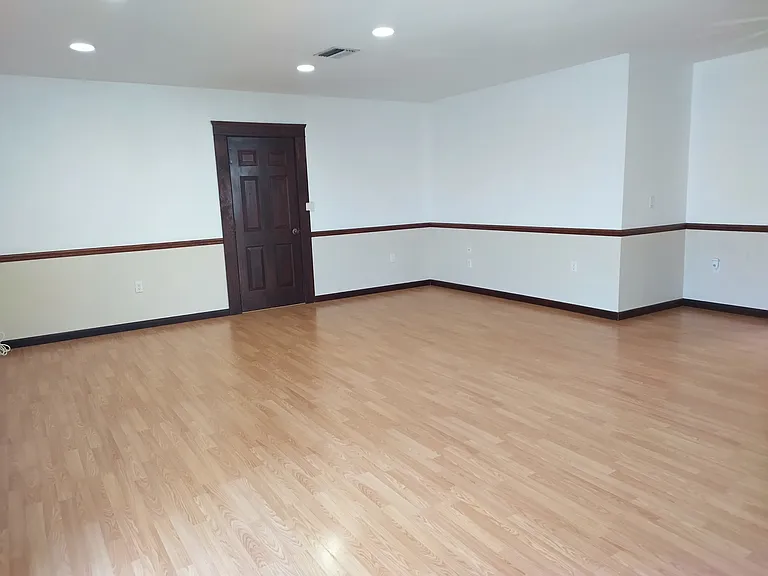 Main living area with door leading to 12'x12' storage room and laundry room.