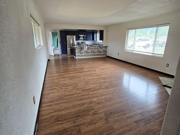 Hallway looking into LR and kitchen