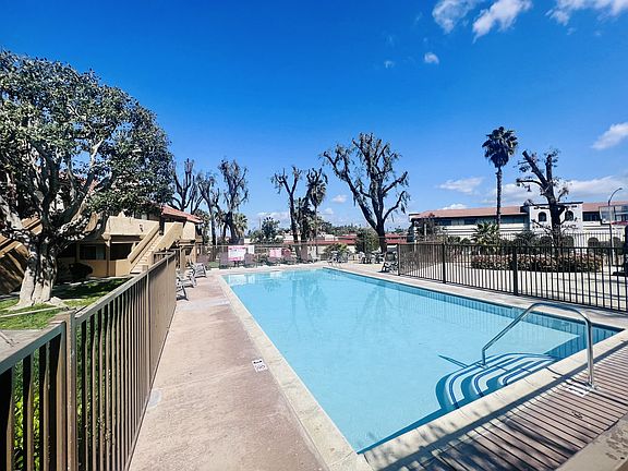 Large fenced swimming pool at Grande Vista Apartments
