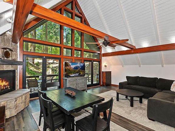 Living Room with Soaring Ceilings and Custom Rock Fireplace!