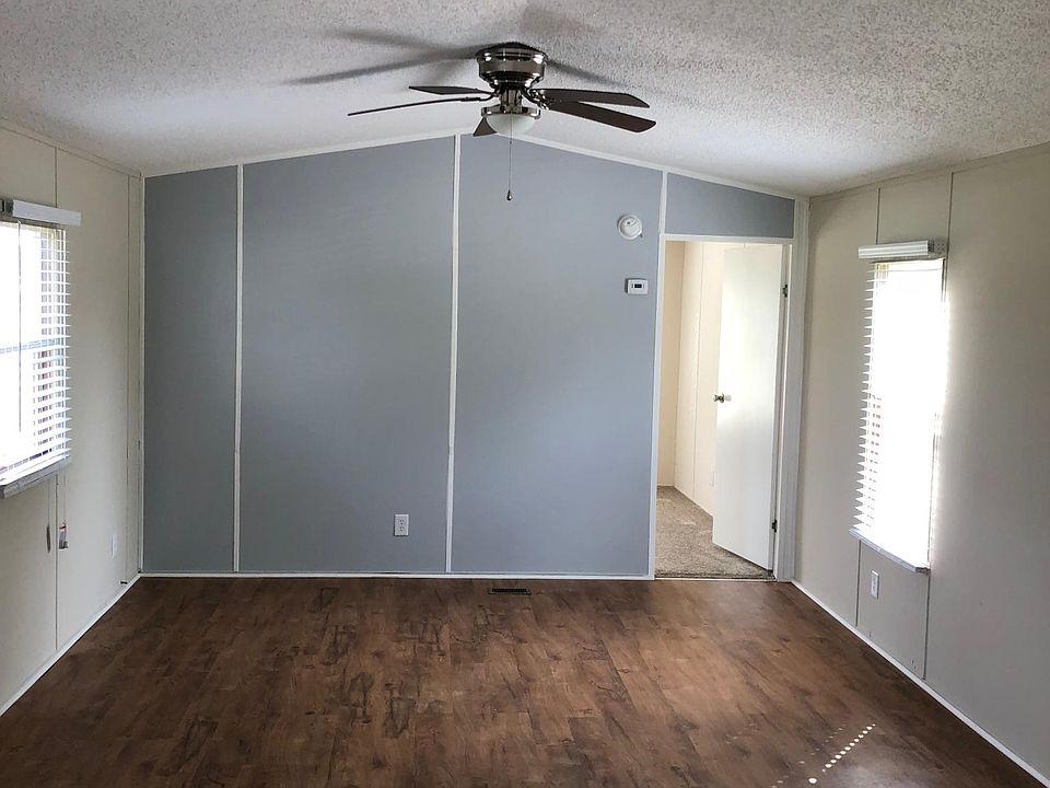 New wood floors in Living Room, new paint and new light fixt