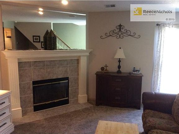 Living room with gas start fireplace.