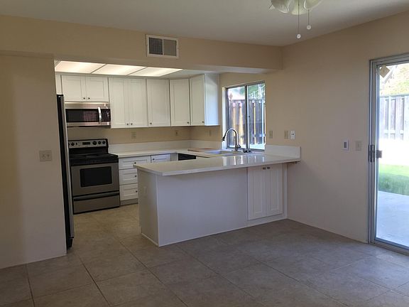 Gorgeous new kitchen with quartz countertops and stainless appliances