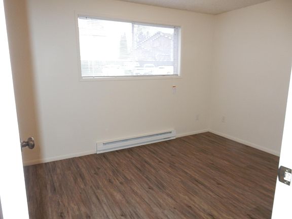Large guest bedroom with new wood grain inspired vinyl floor