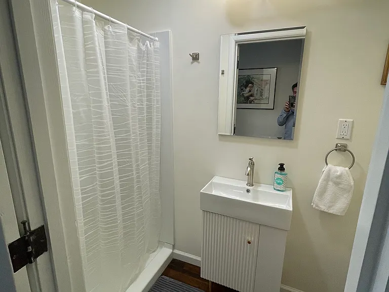 Hall bath with large shower.