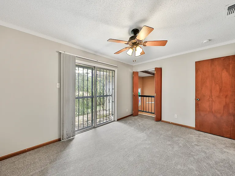 Upstairs bedroom with balcony