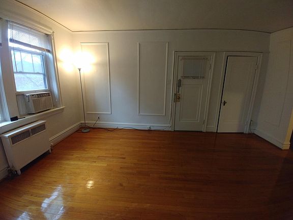 Living room facing main entrance and closet.