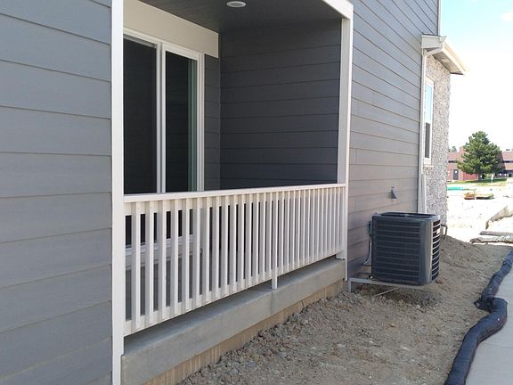Lower-level deck exterior with sliding glass doorway.