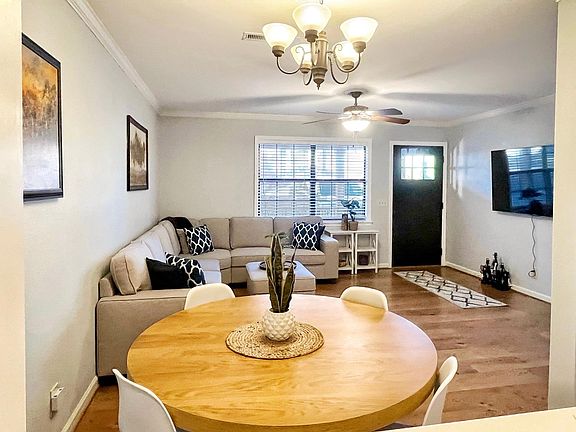 Living Room & Dining Area w/ 65" Smart TV