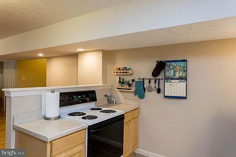 Oven now has an oven range installed above it, walls have been painted, photos coming soon.