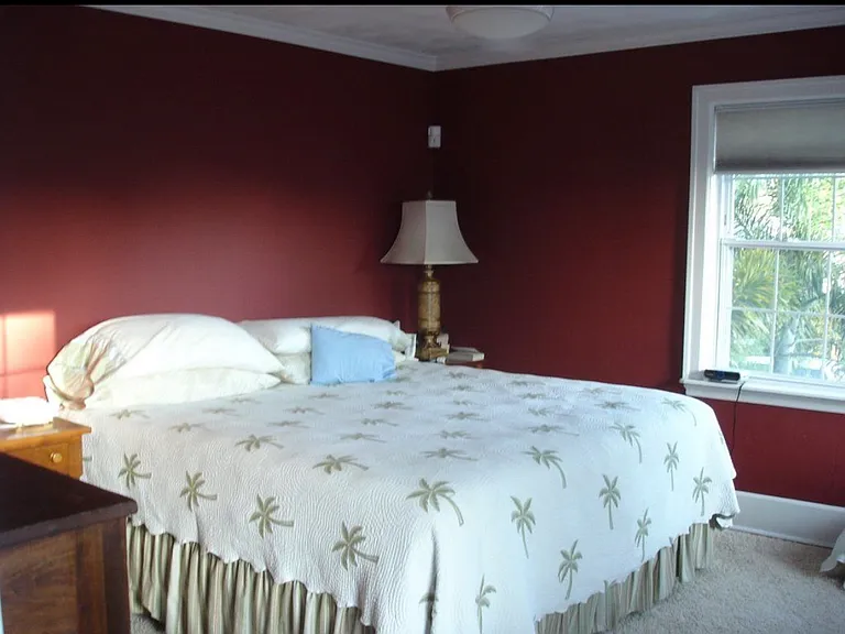 Upstairs primary bedroom, pictured with king bed