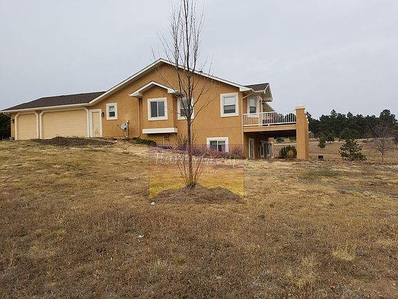 Exterior- Patio Off Main Level and Walkout From Basement