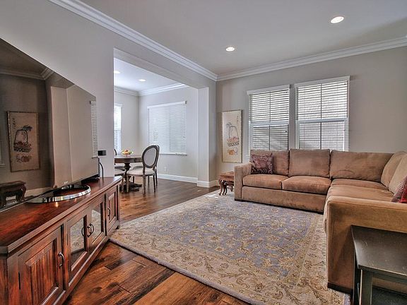 Up the split level to the family room. Dining space across the kitchen