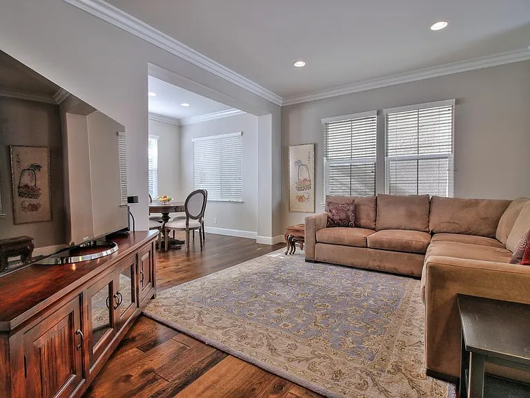 Up the split level to the family room. Dining space across the kitchen