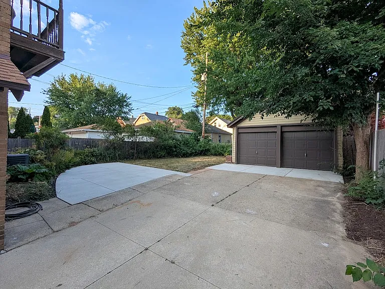 Two car garage. Each unit gets one garage space. Newly poured concrete slab for entertaining outdoors