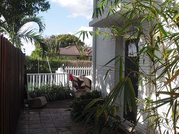 Main side entrance with bamboo and water view