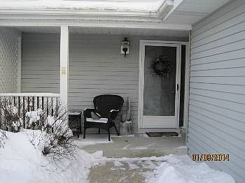 The covered front porch has plenty of space for seating to enjoy the peaceful surroundings.  Perfect for inviting friends and family into your home.