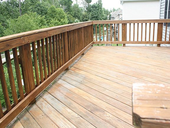 Oversized Deck overlooking wooded backyard