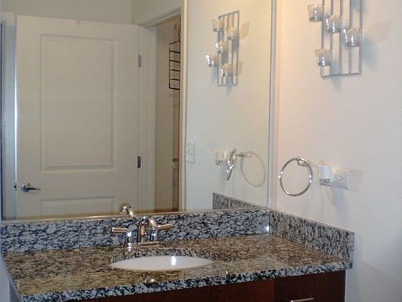 Granite countertops continue in this beautiful bathroom w/ large soaking tub!