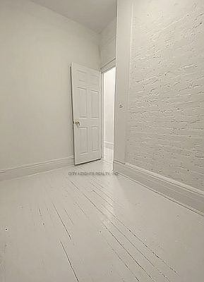 5th image of 211 E 10th St APT 6
