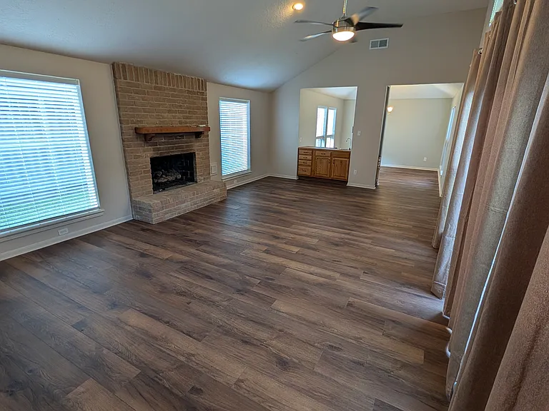 The living and dining space has 11 windows and a sliding glass door to the atrium. Brand new blinds and curtains allow you to tailor the light to your desires.